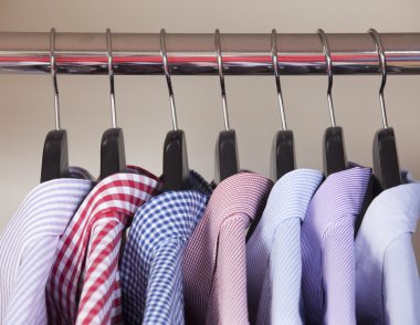 variety of shirts on hangers clipart