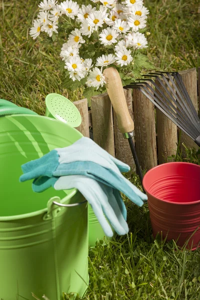 Garden tools on grass in yard — Stock Photo, Image