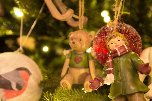 Christmas toy "boy" on the christmas tree — Stock Photo, Image