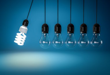 Energy saving bulb and incandescent bulbs in perpetual motion clipart