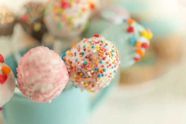 Macro shot of cake pops decorated by colorful sprinkles — Stock Photo, Image