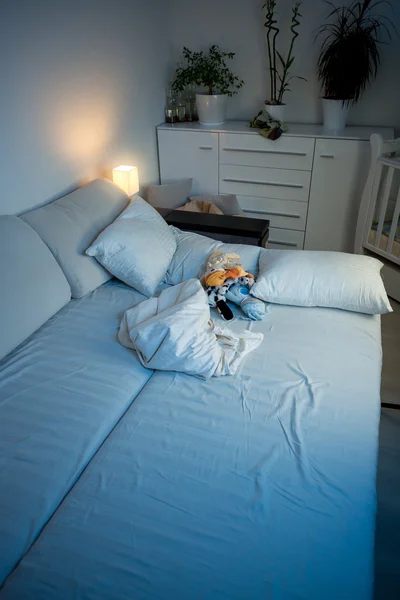 Empty bed in bedroom at night — Stock Photo, Image