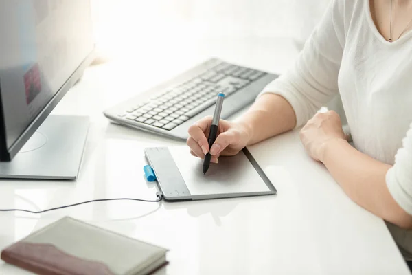 Closeup of young woman using graphic tablet at office — Stock Photo, Image