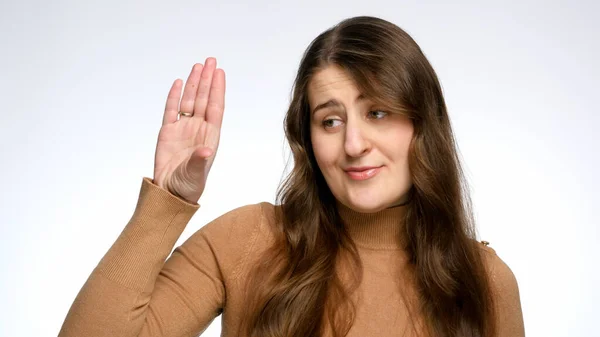 Studio portrait of young woman making blah-blah-blah gesture with hand — Stock Photo, Image