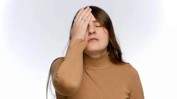 Studio portrait of stressed and annoyed woman making facepalm gesture. Concept of frustration and disappointment. — Stock Photo, Image