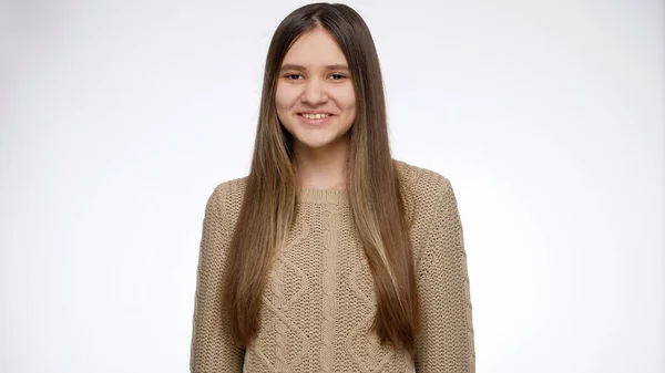 Studio portrait of happy teenage girl smiling and laughing in camera over white background — Stock Photo, Image