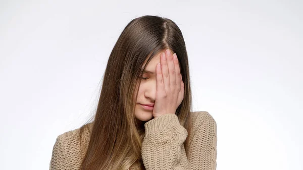 Portrait of displeased girl making facepalm gesture and hitting face with hand — Stock Photo, Image