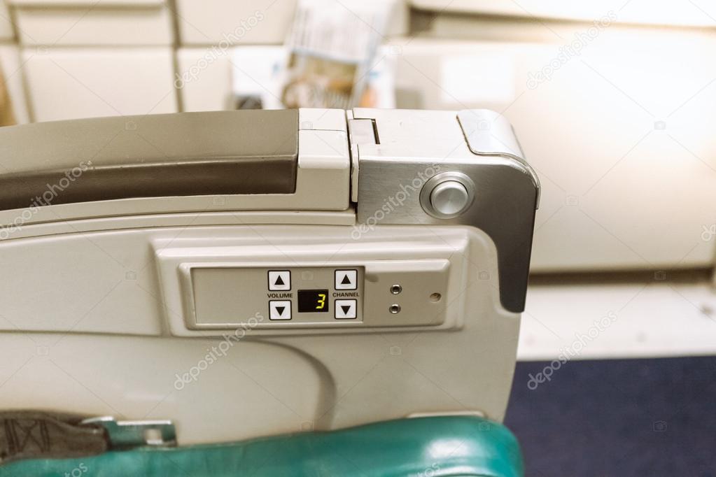 Armrest on airplane seat with buttons Stock Photo by ©Kryzhov 55952057
