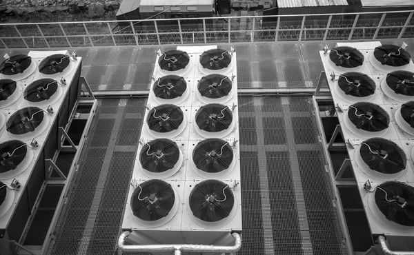 Monochrome photo of long rows of air conditioning systems — Stock Photo, Image