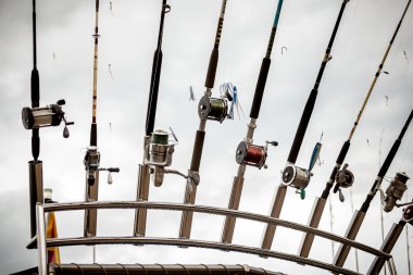 row of fishing rods on ship clipart