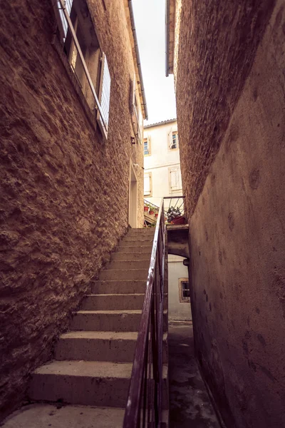 Toned photo of big stairway at narrow street — Stock Photo, Image