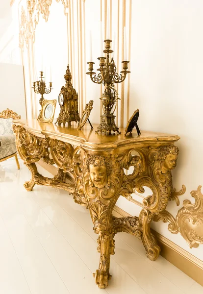 Classic golden table in with old chandeliers — Stock Photo, Image