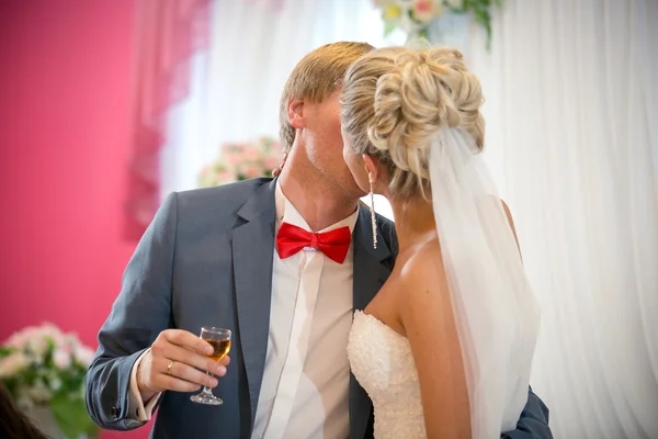 Portrait of bride and groom kissing at restaurant — Stock Photo, Image