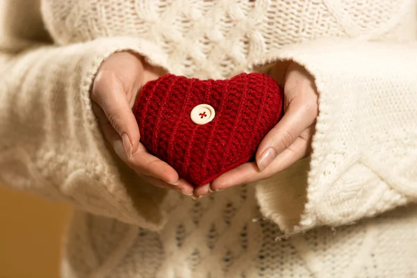 Closeup photo of woman holding heart in hands — Stock Photo, Image