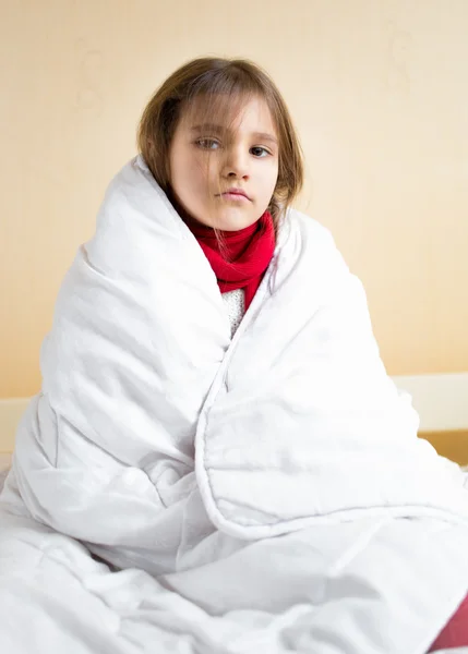 Sad sick girl covering with white blanket — Stock Photo, Image