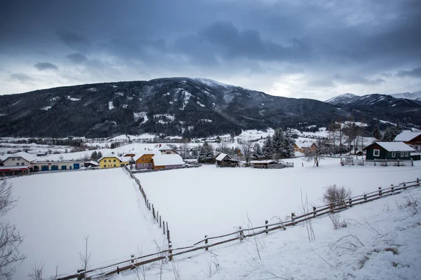 Landscape of Austrian town in valley at Alps covered by snow — Stock Photo, Image