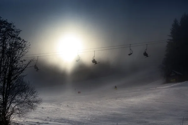 Ski lifts on high mountain covered by snow — Stock Photo, Image