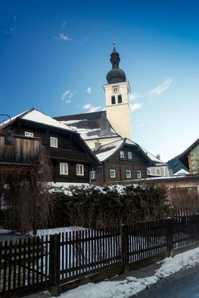 Old catholic church at Austrian village covered by snow — Stock Photo, Image