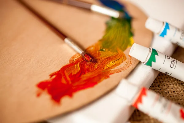 Closeup shot of professional artist tools on table — Stock Photo, Image