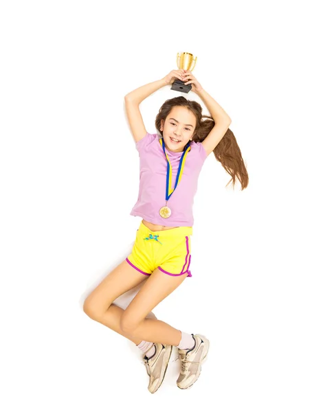 Menina feliz pulando alto depois de tomar o primeiro lugar na competição — Fotografia de Stock