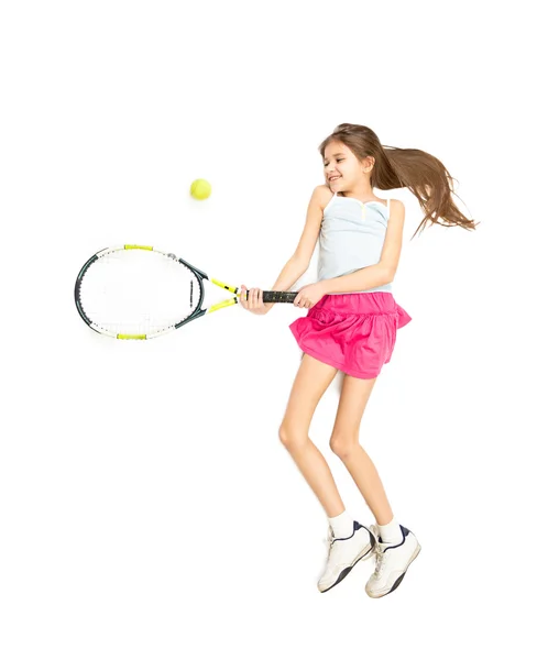 Isolated photo of cute girl jumping and beating tennis ball — Stock Photo, Image