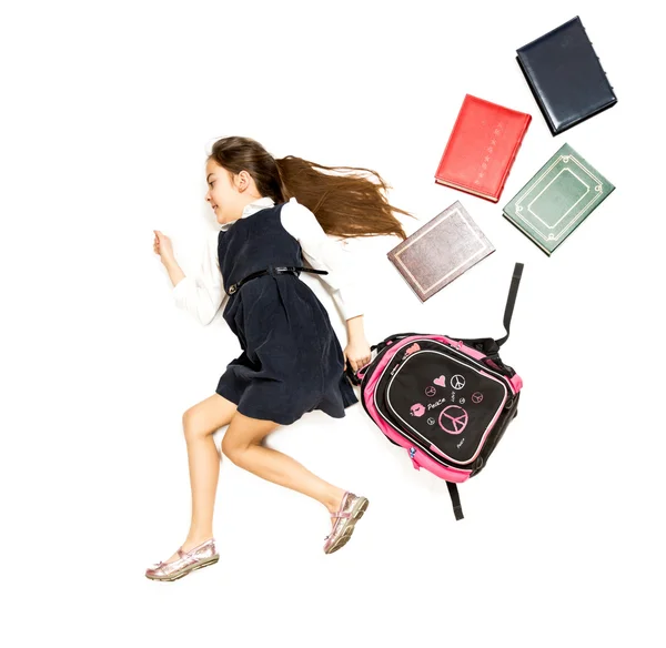 Foto conceptual de linda colegiala corriendo a la escuela con backp —  Fotos de Stock