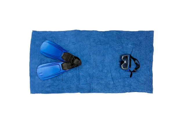Top view photo of snorkeling equipment lying on blue beach towel — Stock Photo, Image