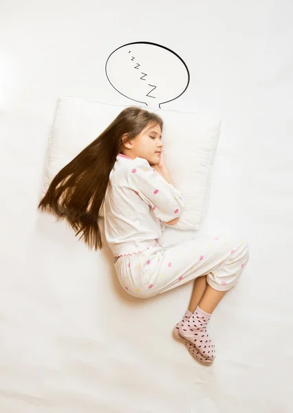 Bonito menina dormindo no Grande almofada com fala bolha — Fotografia de Stock