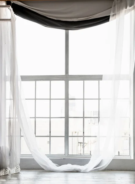 High window from ceiling to floor with long white curtains — Stock Photo, Image