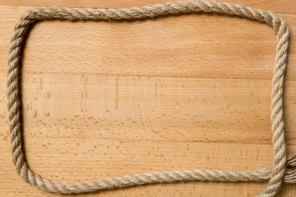 Рамка для тексту з морської мотузки на дерев'яних дошках — стокове фото