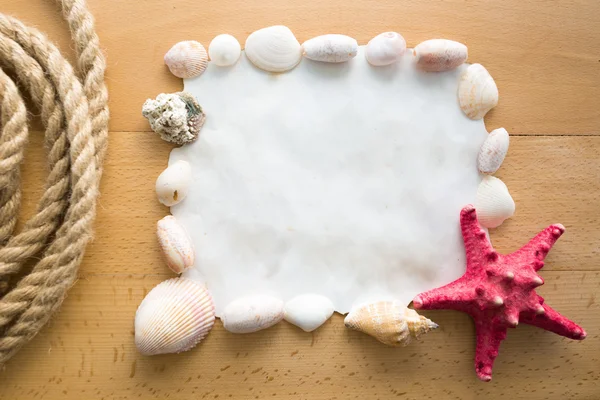 Frame with copy space decorated by seashells and red starfish — Stock Photo, Image