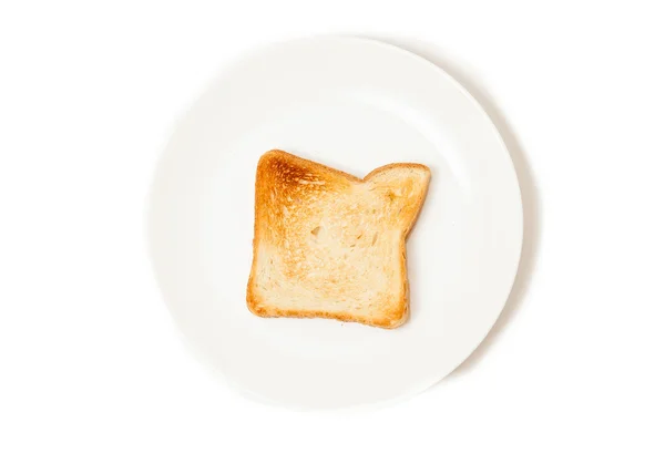 孤立的新鲜烤吐司面包上白盘子里的镜头 — 图库照片