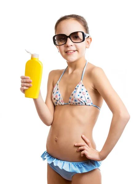 Portrait of happy smiling girl posing with sunblock lotion — Stock Photo, Image