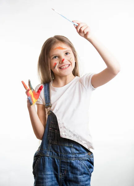 Girl drawing in the air with paintbrush over white background — Stock Photo, Image
