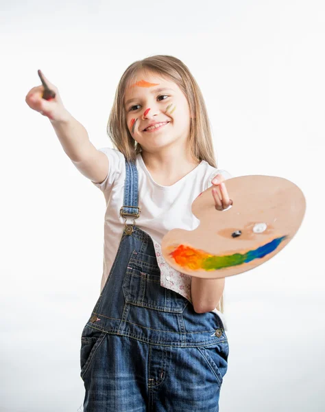 Portrait of drawing little girl holding palette with paints — Stock Photo, Image