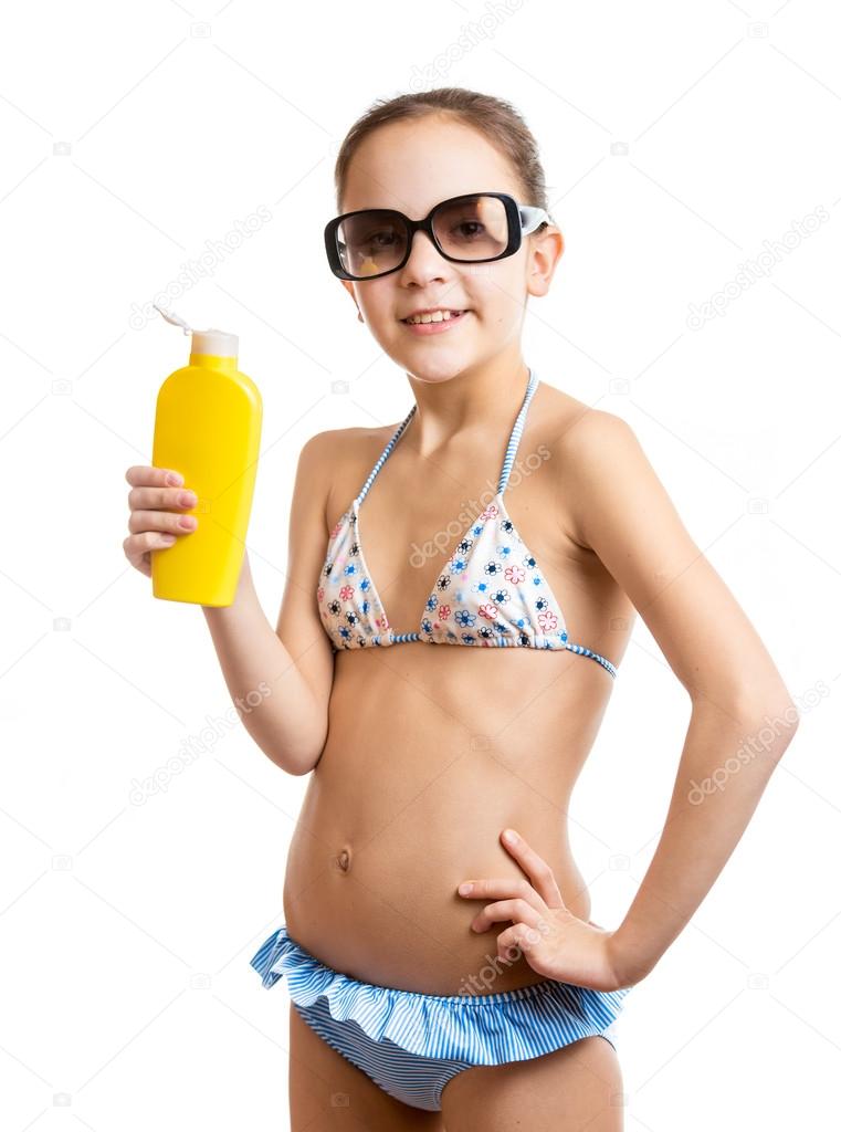 portrait of happy smiling girl posing with sunblock lotion