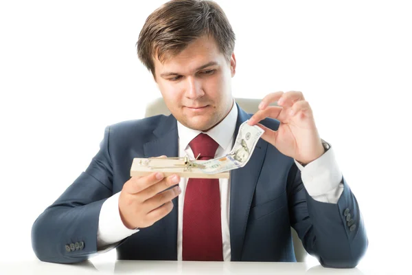 Portrait of businessman holding mousetrap and putting money in i — Stock Photo, Image