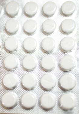 Macro shot of white pills in blister
