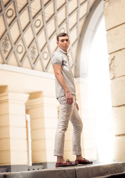 Handsome man walking on street at sunny day — Stock Photo, Image