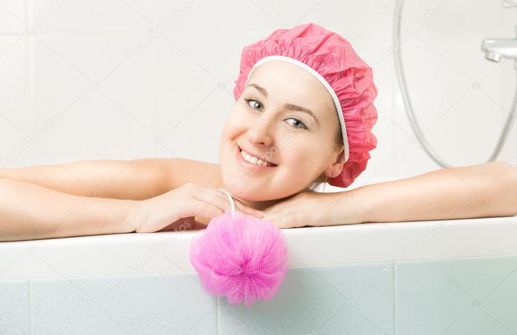 portrait of cute smiling woman posing in bath