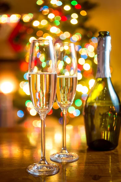 Christmas tree and two glasses of champagne — Stock Photo, Image