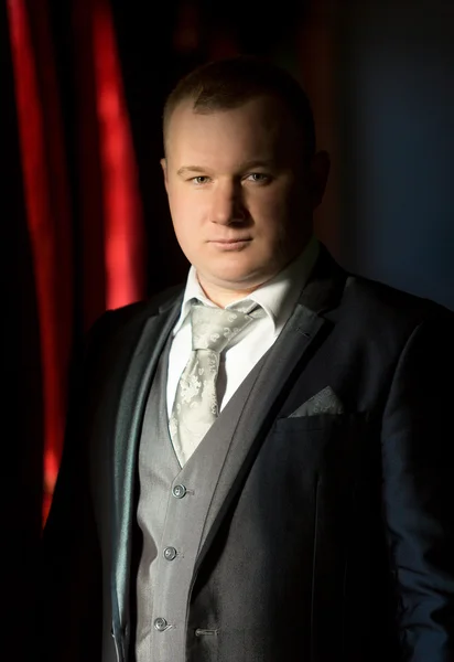 Portrait of retro styled businessman in gray suit — Stock Photo, Image