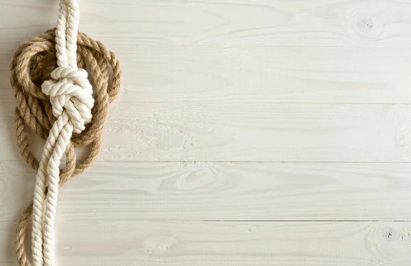 Toned image of ship ropes on wooden background — Stock Photo, Image