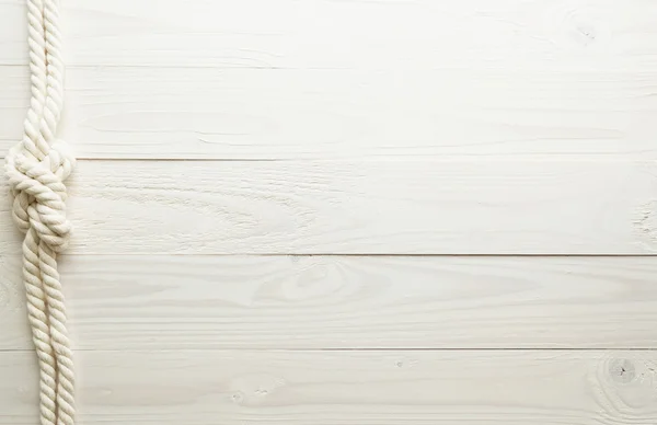 Морський вузол на білому дерев'яному фоні — стокове фото