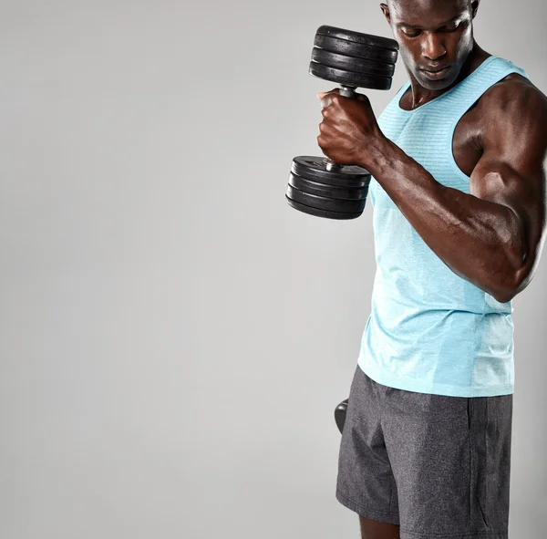 Man working out with dumbbells — Stock Photo, Image