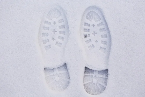 Fußabdruck im Schnee lizenzfreie Stockfotos