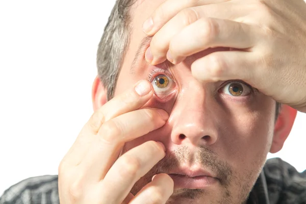 Changing contact lenses Stock Image