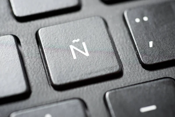 Spanish letter on a gray laptop keyboard.