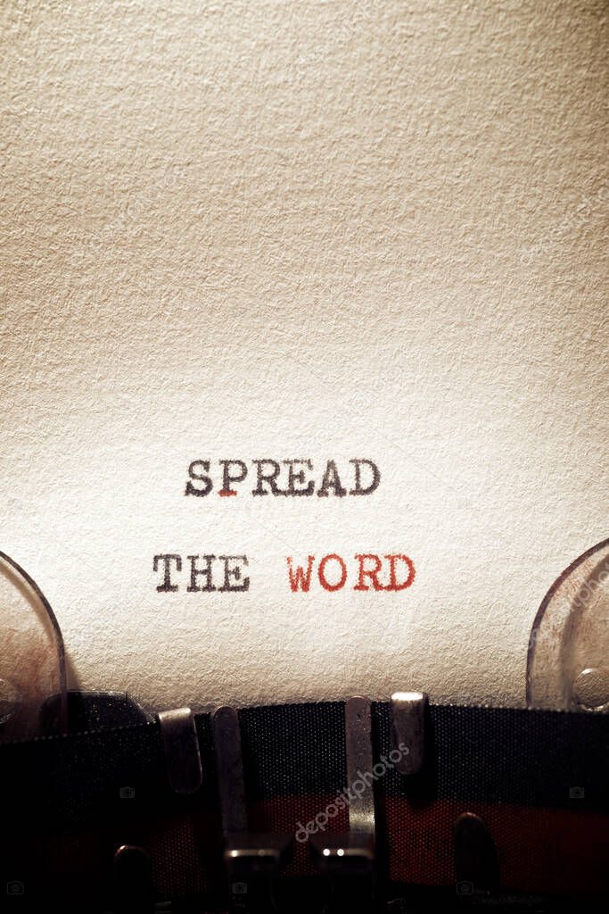 Spread the word phrase written with a typewriter.