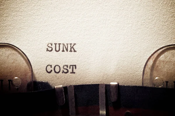 Sunk cost phrase written with a typewriter.